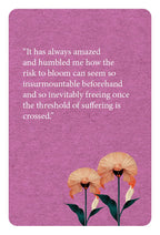 Purple card with floral design and inspirational quote on a pink background