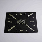 Black cloth with white text and symbols on a gray background