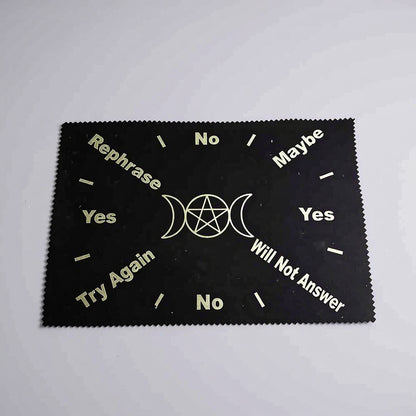 Black cloth with white text and symbols on a gray background