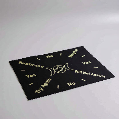 Black cloth with white text and symbols on a gray background