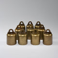 Set of bronze cowbells on a gray background