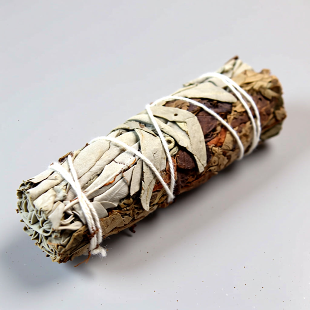 White Sage bundle tied with white string on a light gray background