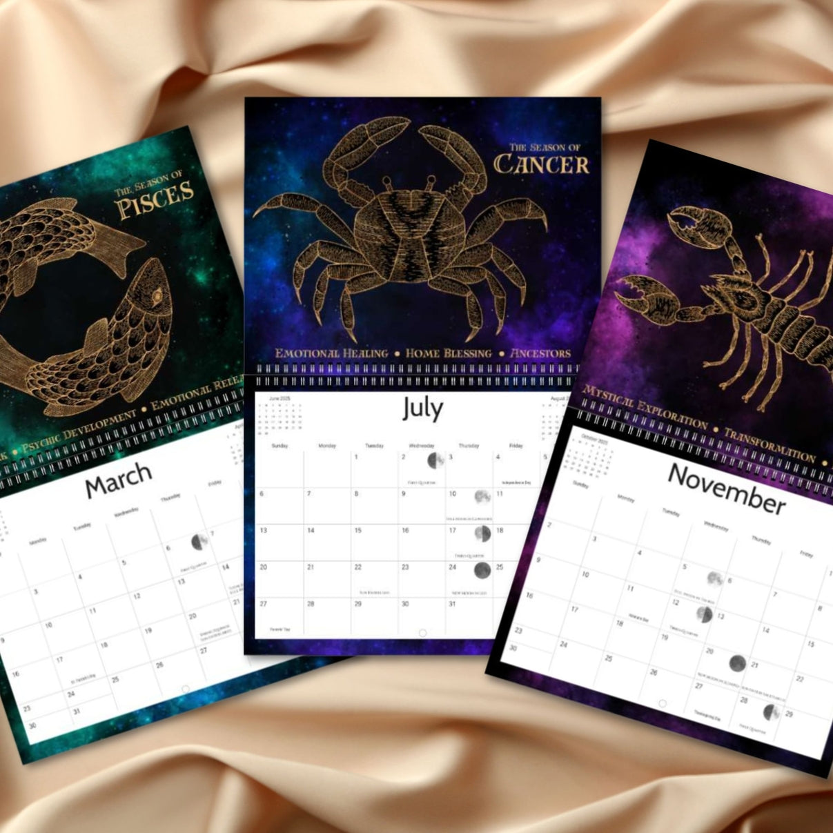 Three astrological calendars for March, July, and November on a beige fabric background.