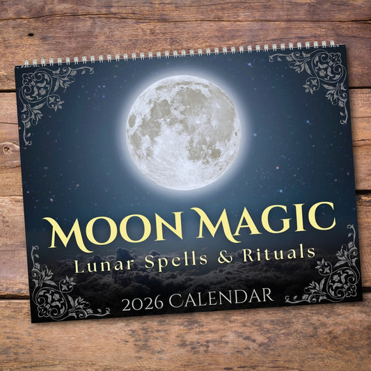 Calendar titled 'Moon Magic: Lunar Spells & Rituals' on a wooden surface